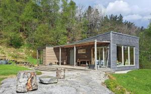 a small cabin in the middle of a forest at Self-Built Cabin With Views Over Leirvik in Leirvik