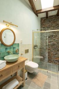 a bathroom with a sink and a glass shower at Burg Coraidelstein in Klotten +32 photos