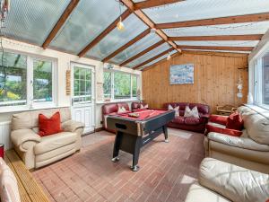 a living room with a ping pong table at Captains Quarters - 16266 in Staithes