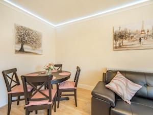 a living room with a table and a couch at Squirrel Cottage - Uk37886 in Stanhope