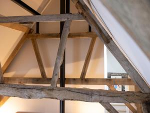 a view of the wooden rafters of a roof at Hatchers Barn - Uk42080 in East Garston