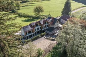 an aerial view of a house with solar panels on it at Cirus Riverfront Kolpa & Rafting in Kočevje