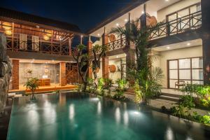 a swimming pool in the middle of a house at Soulstar Villa Ubud in Ubud