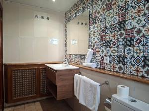 a bathroom with a sink and a mirror at Hotel 139 in Castelldefels +66 photos