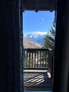 a view of the mountains from the porch of a house at ComeCasa La Magdeleine 2BDR APT in La Magdeleine +13 photos