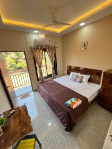 a bedroom with a large bed in a room at Satvik Homestay in Devgarh