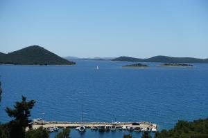 a large body of water with boats in it at Apartman Mala Artica in Drage +41 photos