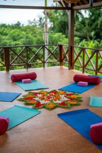 a group of yoga mats on a wooden floor at Soulstar Villa Ubud in Ubud