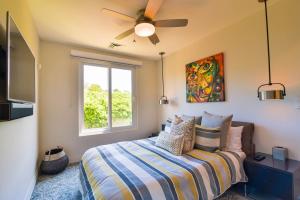 a bedroom with a bed and a window at Miramar 5B 2 bdr Ocean View in Los Suenos in Herradura +25 photos