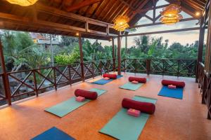 an overhead view of a yoga room with red and blue mats at Soulstar Villa Ubud in Ubud