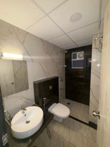 a bathroom with a sink and a toilet at Belle Vue Stays in Jaipur
