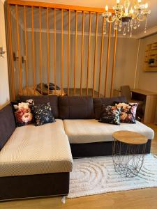 a living room with a couch and a table at the HAPPY PLACE in Mykolaiv