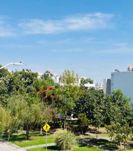 a park with trees and a city in the background at Camino antiguo a Tesistan in Zapopan