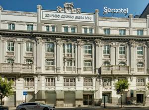 a large white building with a sign on it at Sercotel Coliseo in Bilbao +44 photos