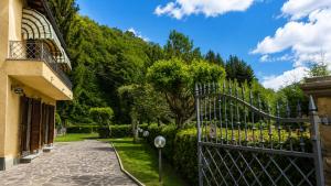 a gate to a garden with a hill in the background at Villa Marisa in Stazzema