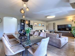 a living room with a dining table and a couch at Holiday Home Sara by Interhome in Tar