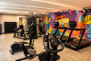 a gym with several tread machines in a room at Slaviero Hotel Ponta Grossa in Ponta Grossa