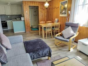 a living room with a couch and a table at Apartment Ritz by Interhome in Ernen