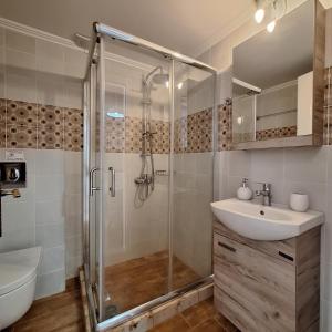 a bathroom with a shower and a sink at Casa di Sofiana by wood and stone in Áyios Pétros +19 photos