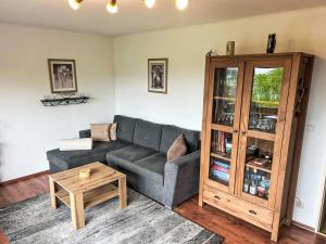 a living room with a couch and a coffee table at Apartment Panorama by Interhome in Berghofen