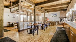 a dining room with wooden tables and chairs at Georgetown Lodge in Georgetown