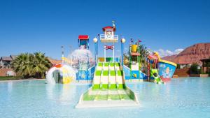 a water park with a water slide in the water at Desert Solitaire #101 in Santa Clara