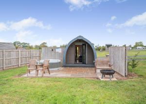 a dome tent in a yard with a table and chairs at South View Retreat in Carlton