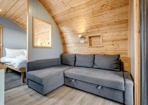 a living room with a couch and a bed at South View Retreat in Carlton +153 photos