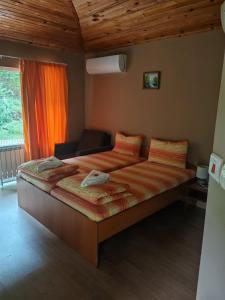 a bedroom with a large bed in a room at Hotel Valdis in Pastra +33 photos