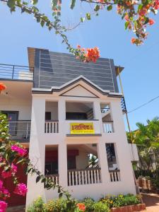 a house with solar panels on the roof at Satvik Homestay in Devgarh