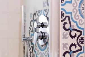 a bathroom door with a mirror next to a shower at B&B Fontanella 32 in Porto SantʼElpidio +80 photos
