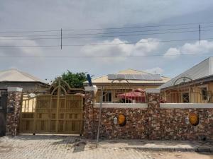 a stone building with a wooden gate in front at St Nicholas Guest Inn in Galadima +4 photos