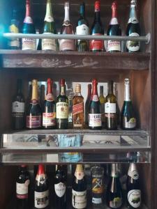 a refrigerator filled with lots of bottles of alcohol at St Nicholas Guest Inn in Galadima