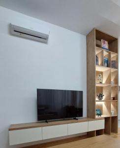 a living room with a flat screen tv on a wall at D&M Lux1 in Podgorica