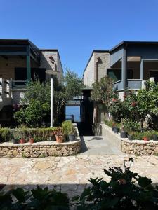 a house with some plants in front of it at Renissa's Beach Suite in Vlorë