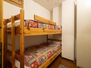 a bedroom with two bunk beds in a room at Apartment Casa Rossa by Interhome in Madesimo
