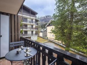 a balcony with a table and a view at Apartment Casa Rossa by Interhome in Madesimo