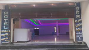 an entrance to a building with a purple and green ceiling at Hotel bandana residency in Rājgīr