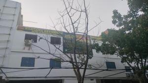 a building with a banner on the side of it at Hotel bandana residency in Rājgīr