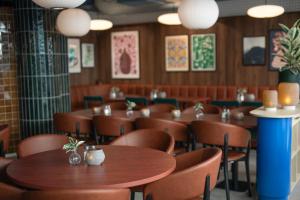 a dining room with wooden tables and chairs at Comfort Hotel City in Gothenburg +32 photos