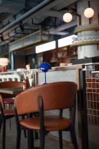 a group of tables and chairs in a restaurant at Comfort Hotel City in Gothenburg