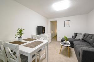 a living room with a couch and a table at Gasparevic Apartments in Rovinj +11 photos