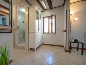 a bathroom with a walk in shower and a mirror at Studio Piccolo Mondo by Interhome in Lovran