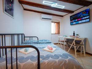 a bedroom with a bed with two towels on it at Studio Piccolo Mondo by Interhome in Lovran