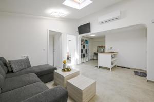 a living room with a couch and a table at Gasparevic Apartments in Rovinj