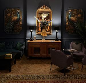 a living room with a mirror and a table at West Rocks Hotel in Eastbourne +43 photos