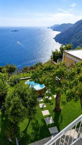 a view of the ocean from the balcony of a house at Arcu Retreat in Positano