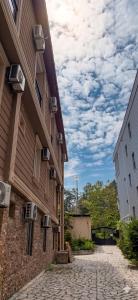 a building with air conditioners on the side of it at Guest House Kobuleti 516 in Kobuleti +34 photos