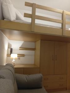 a living room with a bunk bed and a couch at Kimourioti Green House in Sitia