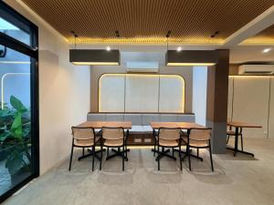 a conference room with a table and chairs at Grand WK Hotel in Yogyakarta